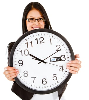 Business time with a woman holding a clock - isolated over white